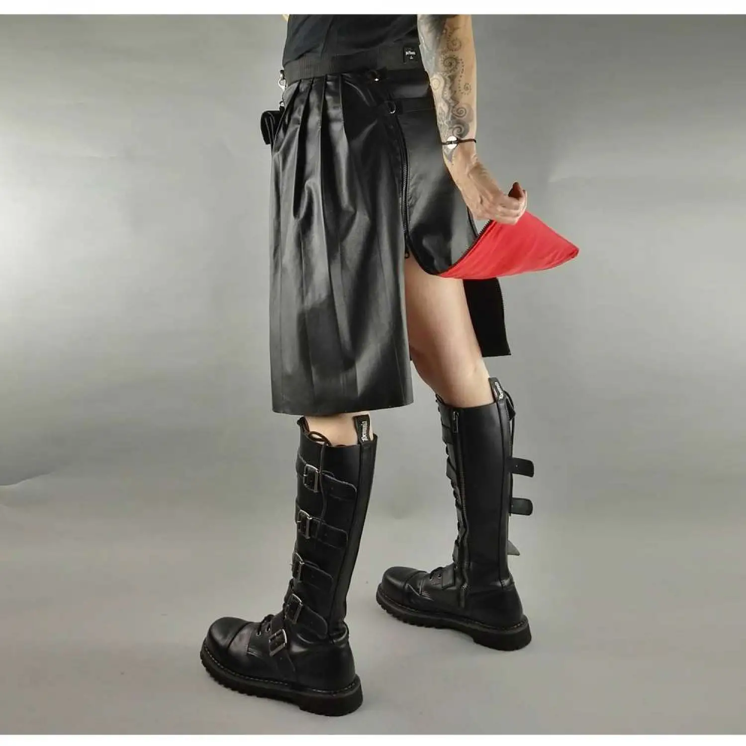 Men's black faux leather kilt with knife pleats and utility pocket detail