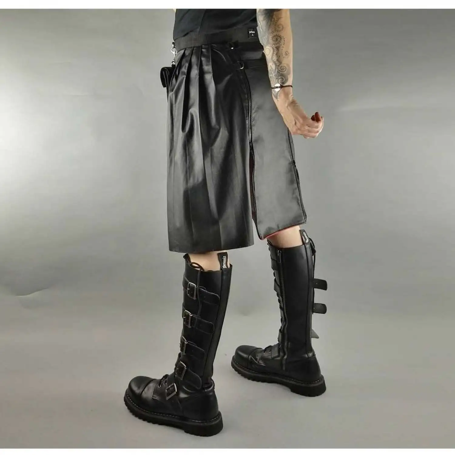 Men's black faux leather kilt with knife pleats and utility pocket detail