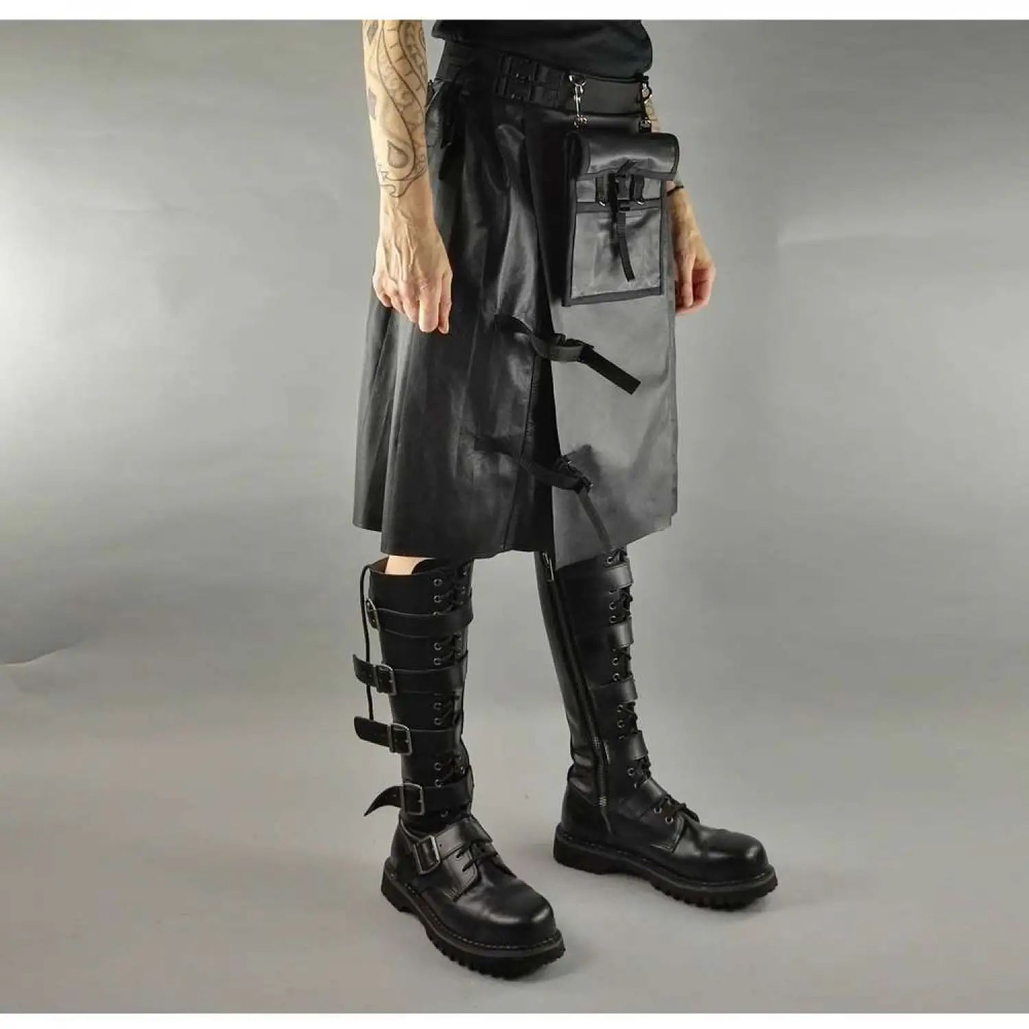 Men's black faux leather kilt with knife pleats and utility pocket detail