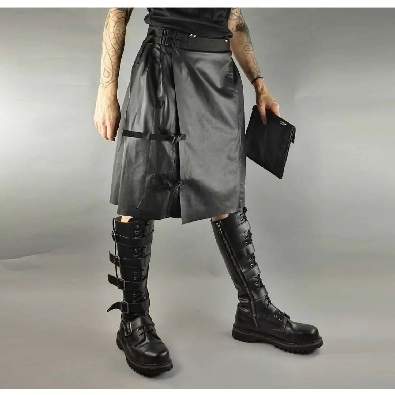 Men's black faux leather kilt with knife pleats and utility pocket detail